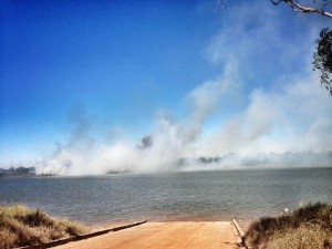 Fire on the other side of the McArthur River from the boat ramp.